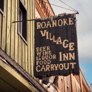 Roanoke village inn sign